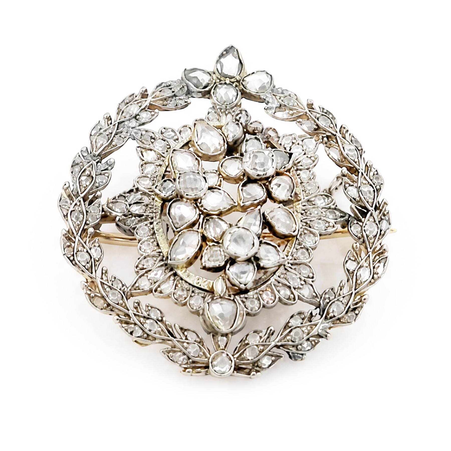 19th century floral spray diamond brooch, three central flower heads set with rose cut and old cut diamonds within an sunburst surround and outer wreath border, set with further rose cut diamonds 