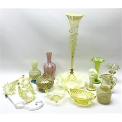 A group of Victorian and later Vaseline glass, to include part epergne, two vases with crimped rims and trailed decoration, a uranium glass vase, lemon Vaseline glass twin handled bowl, etc. 