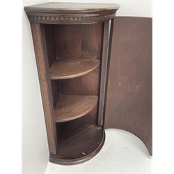 Small late 20th century mahogany cylindrical corner cupboard fitted with two shelves