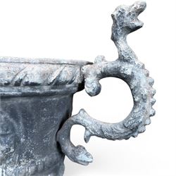 Impressive pair of early highly decorative lead garden urns, griffin handles with ornate decoration depicting cherubs and laurel wreath