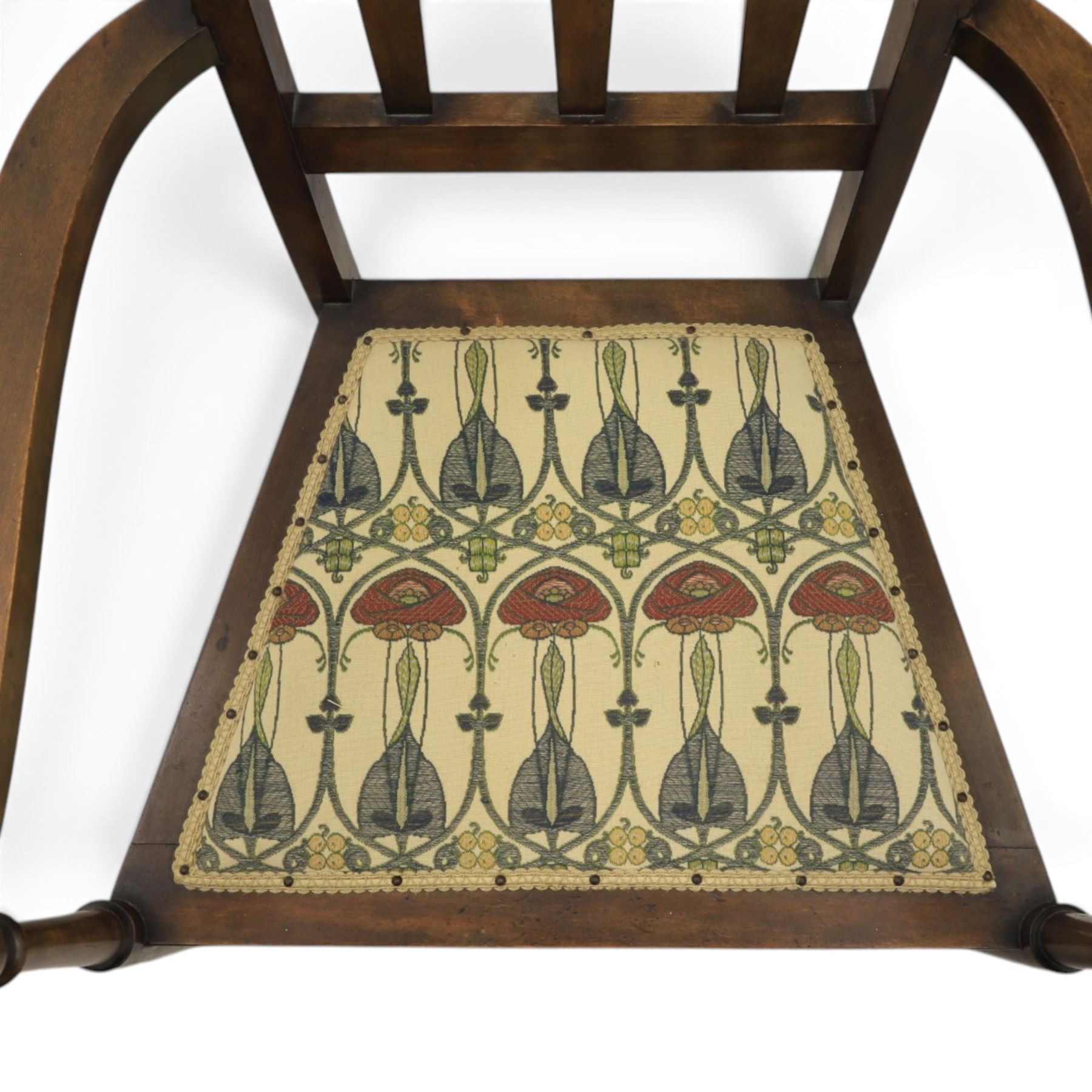 Robson & Sons, Newcastle on Tyne - Arts & Crafts high back armchair, upholstered in Mackintosh style fabric, shaped armrests and cylindrical supports united by stretchers