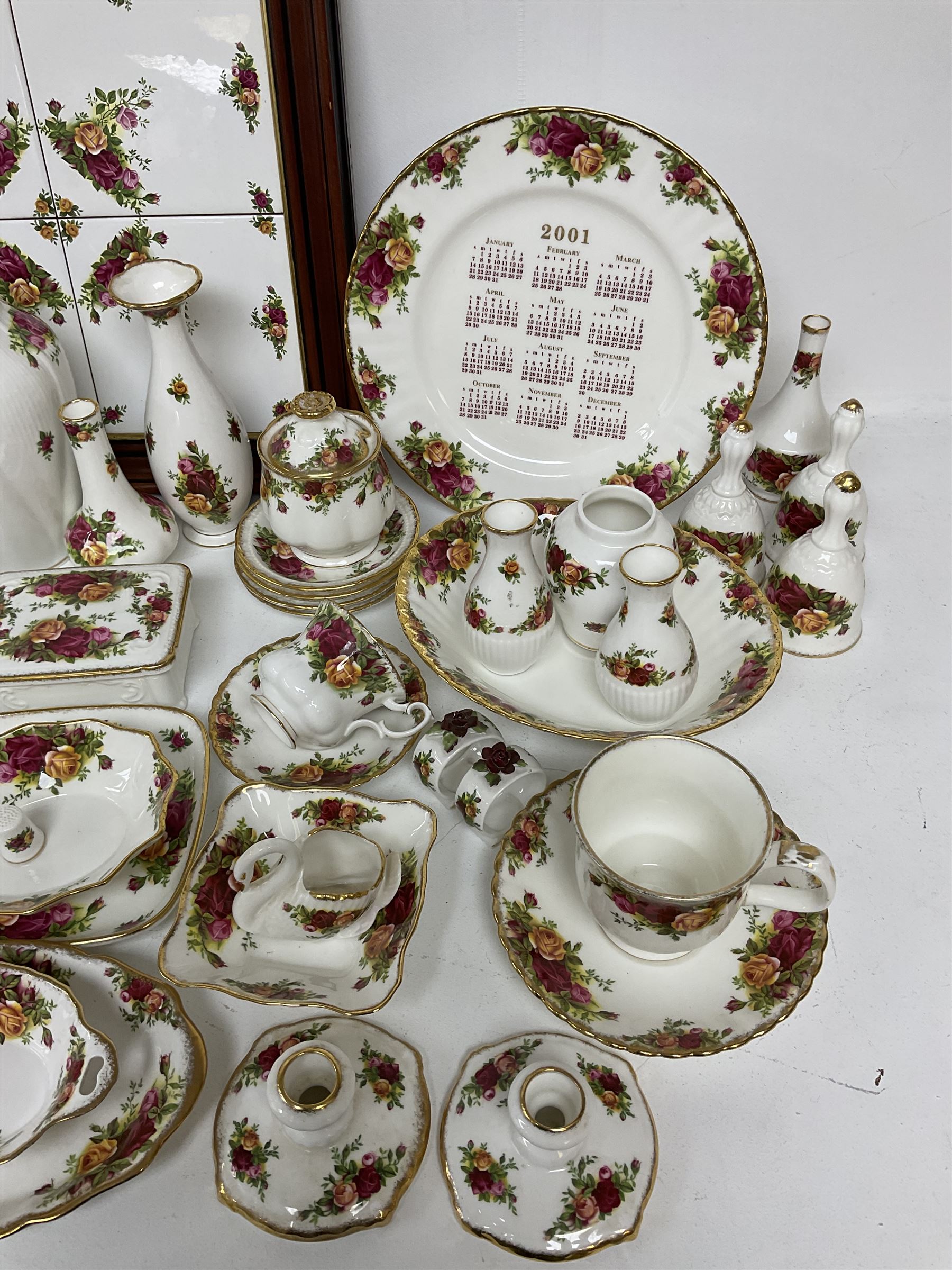 Royal Albert Old Country Roses pattern ceramics, to include table lamp, lidded vase, two pairs of salt and pepper shakers, cups and saucers, plates, biscuit jar, bowls, lidded preserve pot, vases, dishes, knives, napkin rings, lidded jars and box, pair of candlesticks etc
