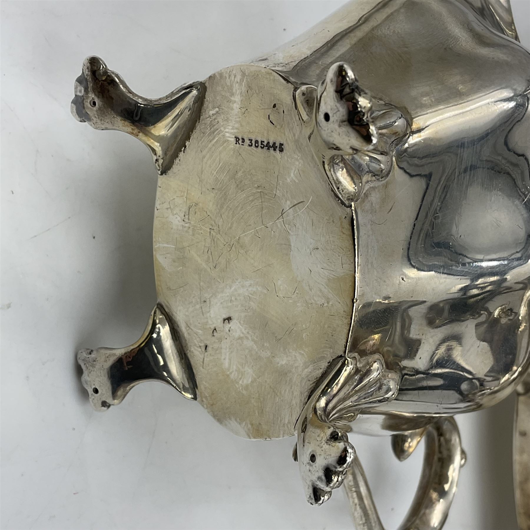 Five piece Edwardian silver tea service, comprising teapot and coffee pot, each with ebonised scroll handle, tea caddy with hinged cover, twin handled open sucrier, and milk jug, each of rounded bombe form, upon four paw feet, hallmarked William Adams Ltd, Birmingham 1904 and 1905, coffee pot H26cm
