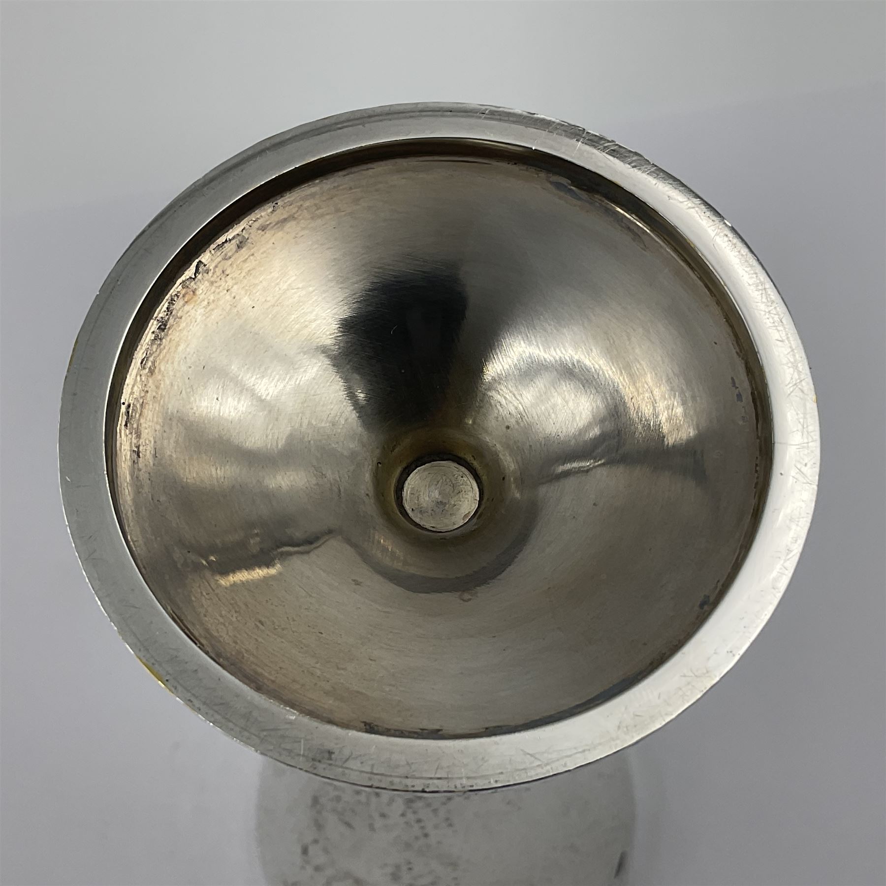 Pair of modern silver goblets by Stuart Devlin, the tapering cylindrical bowls each with spot hammered decoration and gilt interiors, the parcel gilt stems with signature textured detailing and six graduating knops, upon conforming spreading circular foot, hallmarked Stuart Devlin, London 1976, H17.7cm