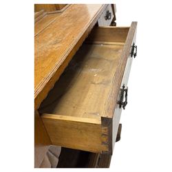 Late 19th century pine dresser, the projecting cornice with dentil and spindle moulded frieze above a three-tier plate shelves, flanked by glazed doors, the base fitted with three frieze drawers over arched apron and carved floral panelled cupboard doors, raised on turned feet