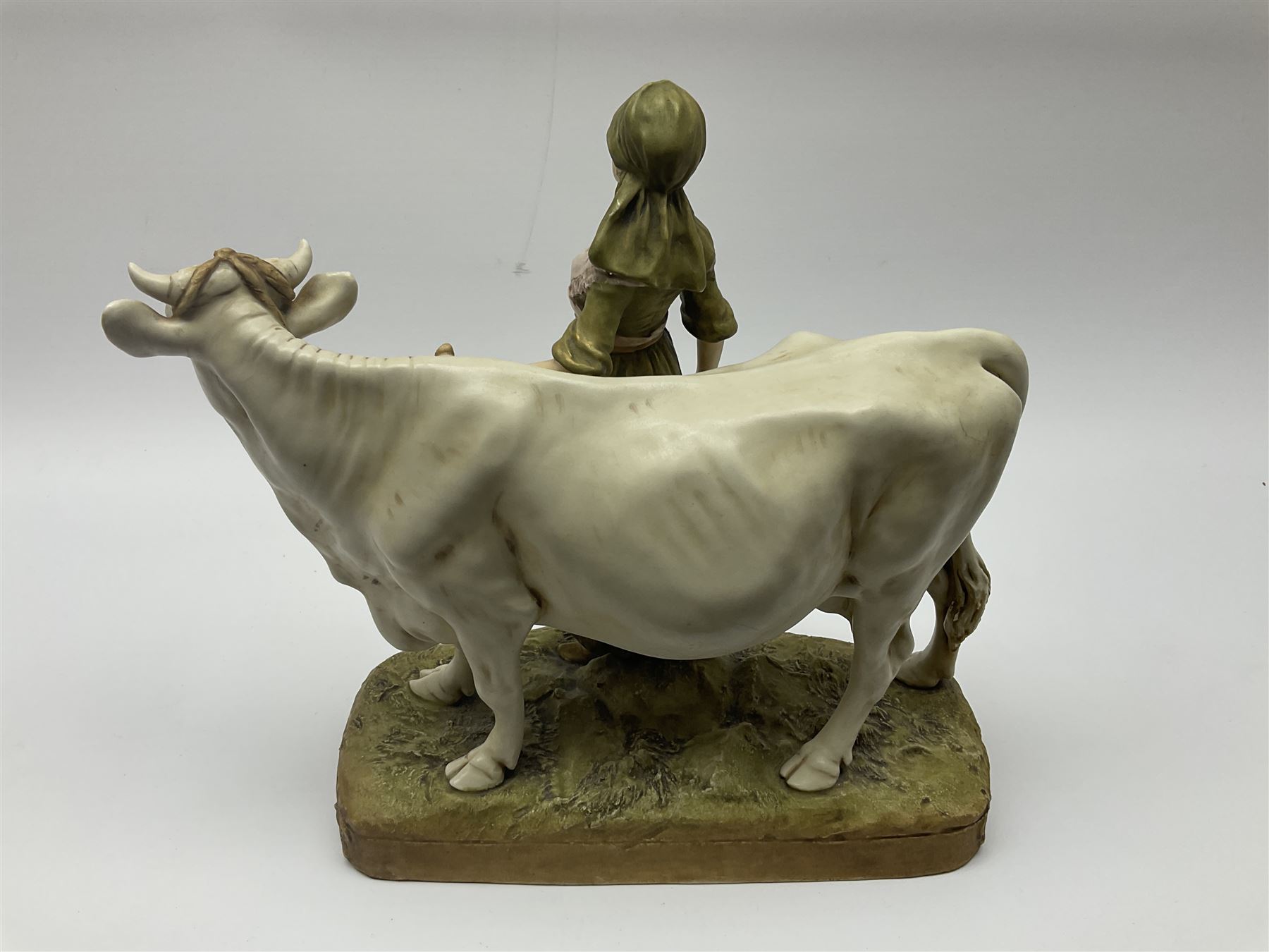 Royal Dux figure of a Milkmaid with Cow, number 988 with applied pink triangle mark to base, H28cm