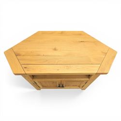 Modern light oak corner television stand, open recess above two cupboard doors with aperture to the back