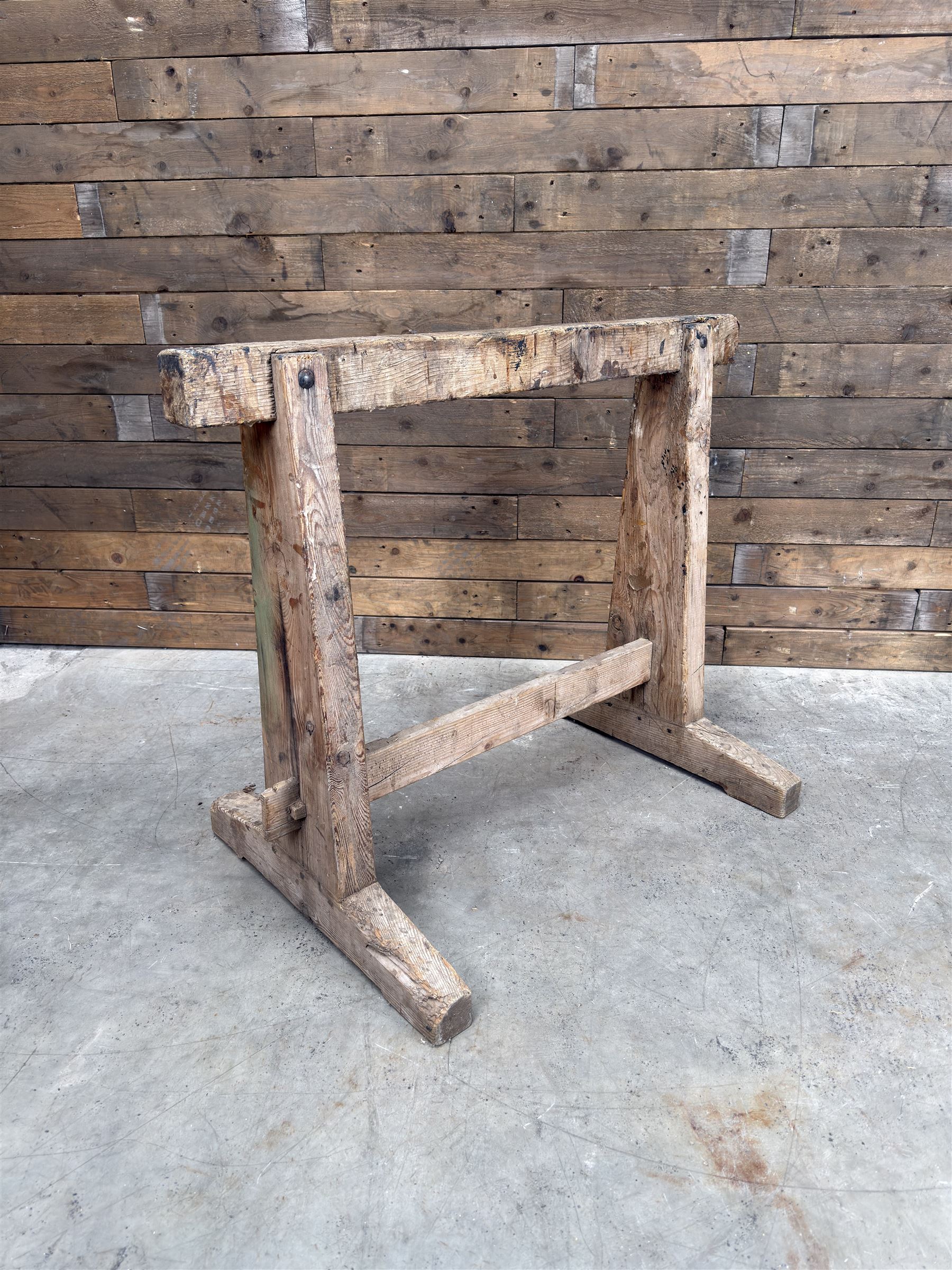 Pair of late 19th century pitch pine trestles, square tapering form in stripped finish