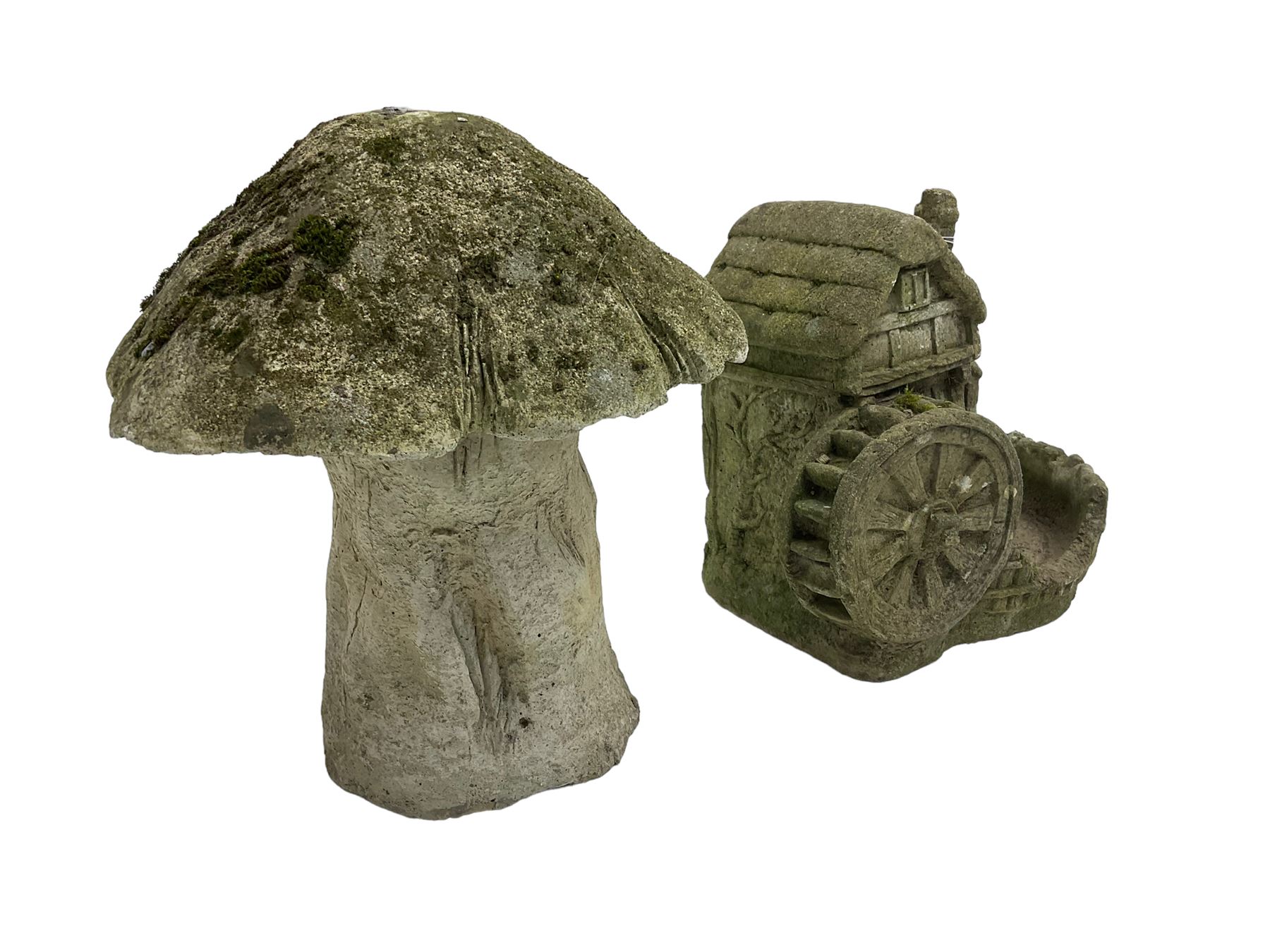 Composite stone garden ornament in the form of a mushroom together with another similar of a windmill (2)