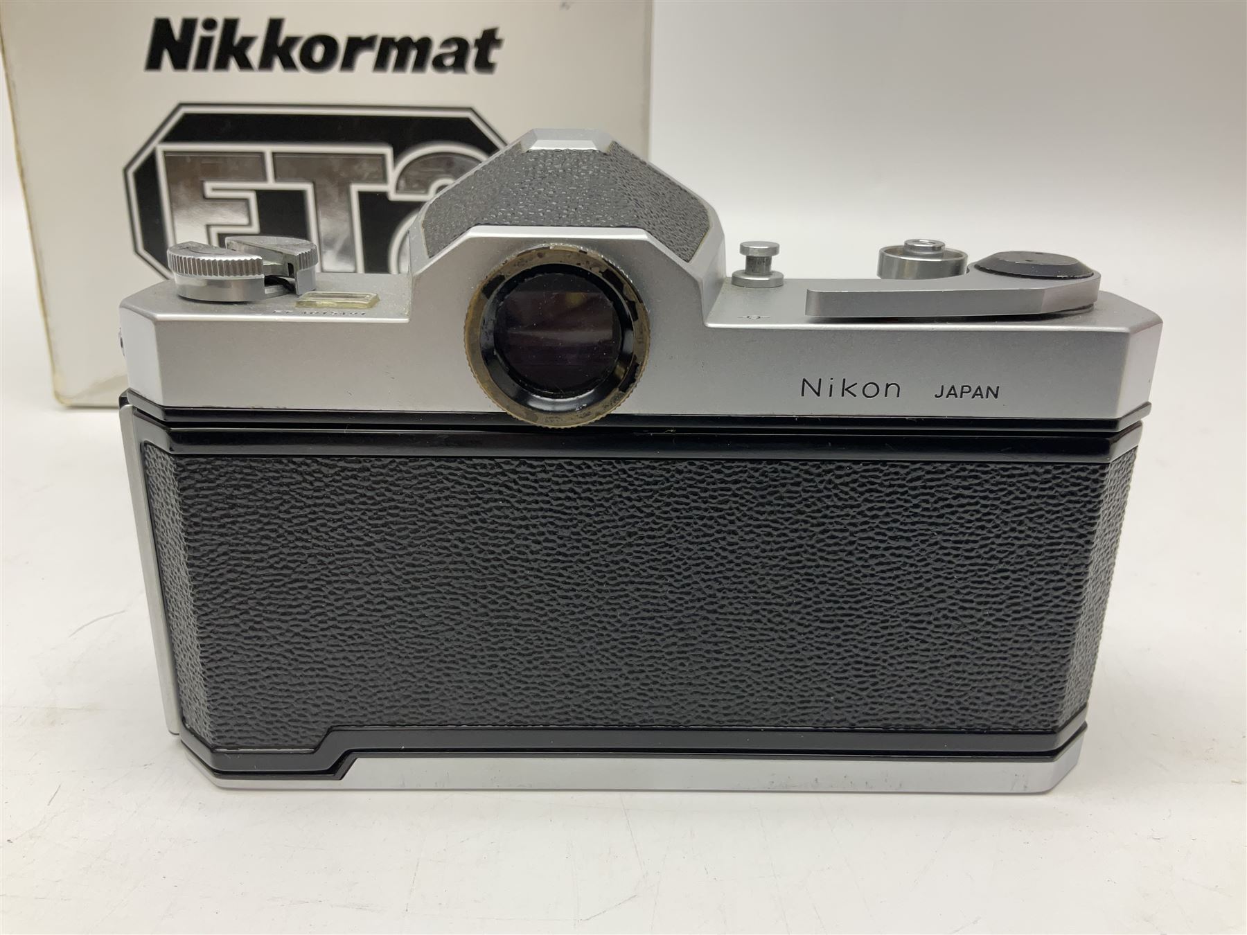 Nikkormat FT2 camera body, serial no. 5066813, in original packaging, together with Nikkormat EL camera body, serial no. 5577358, with Nikon Nikkor 50mm 1:1.8' lens no. 2143575, Nikkormat FT, serial no. 3968385, and Nikomat FT camera body, serial no. 4015491