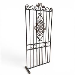 Victorian wrought iron vineyard gate, with ornate scrollwork and foliate acanthus leaf decoration, shaped cresting and central decorative panel, finished in rustic black painted finish