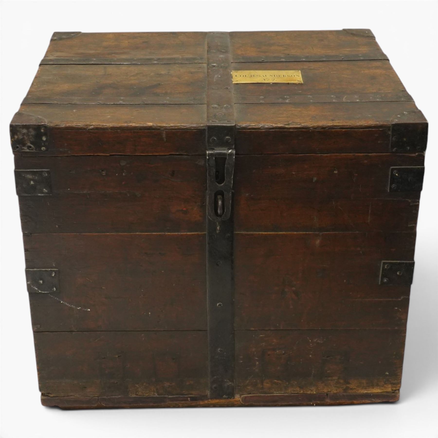 Early 19th century oak and wrought metal bound plate chest, the hinged lid with an engraved brass plaque inscribed Col H Saunderson No.2, enclosing a vacant interior, with metal carrying handles to the sides and pivoting clasp