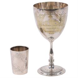 German silver beaker (800 standard), silver plated trophy cup, silver pocket watch, gold plated screw back pocket watch, five silver shilling coins, and some further coins