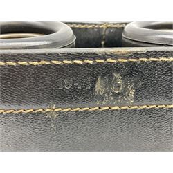 Pair of WWII German U-boat binoculars probably 7 x 50 by Leitz, with rubber eye piece protector covers and leather case stamped with Kriegsmarine mark to the lid and dated 1944, with leather strap.