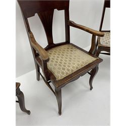 Early 20th century set three (2+1) stained beech beech chairs, raised shaped backs carved with foliage, upholstered seats