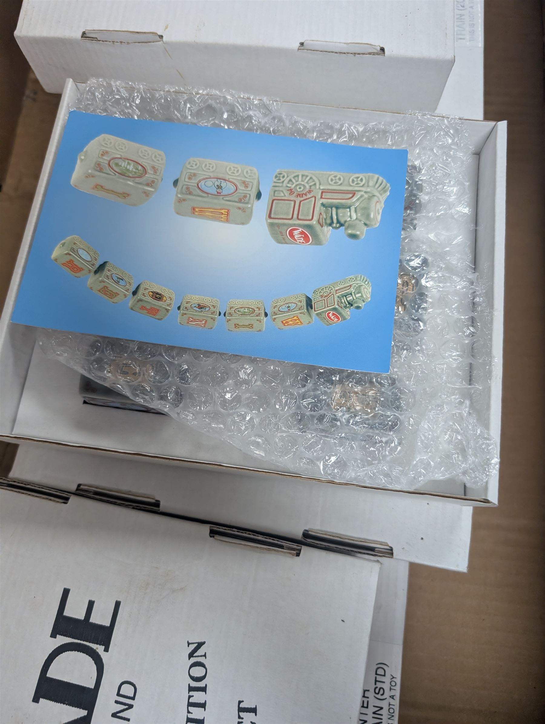 Eight boxed Wade Train Sets, including Autumn Train Gold, Winter Train Gold, Xmas Train 2002, Summer Train etc