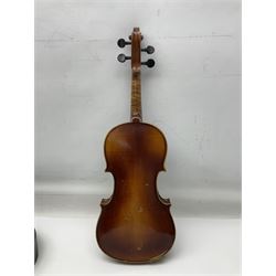 Czechoslovakian violin c1920 with 36cm two-piece maple back and ribs and spruce top, bears label 'Copy of Antonius Stradivarius Made in Czechoslovakia' L59cm; in carrying case; 1950s Czechoslovakian violin; and 195os Czechoslovakian three-quarter size violin; both cased (3)
