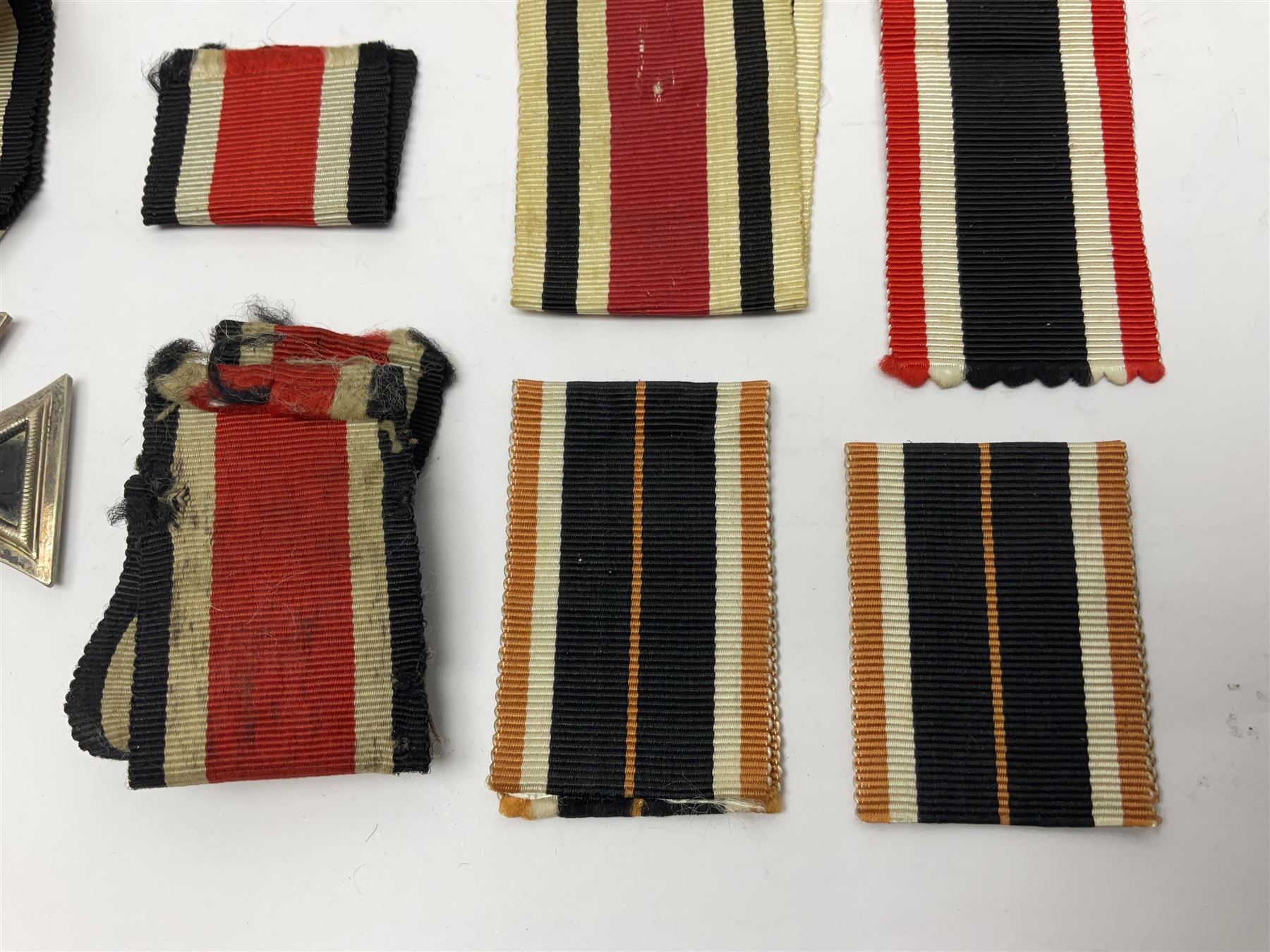 WWII German Iron Cross 2nd Class, the suspension ring stamped 128 for S. Jablonski G.m.b.H. Posen; with ribbon; together with an embroidered cloth eagle badge and quantity of German medal ribbons.