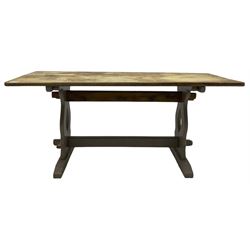 20th century oak refectory dining table, rectangular stripped top on painted base, shaped end supports on sledge feet united by two pegged stretchers