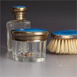 1920s silver mounted blue guilloche enamel travelling dressing table set, comprising hairbrush, comb, bottle and jar, hallmarked RWF Ltd, Birmingham 1927, contained withing tooled leather fitted case with bevelled mirror to interior