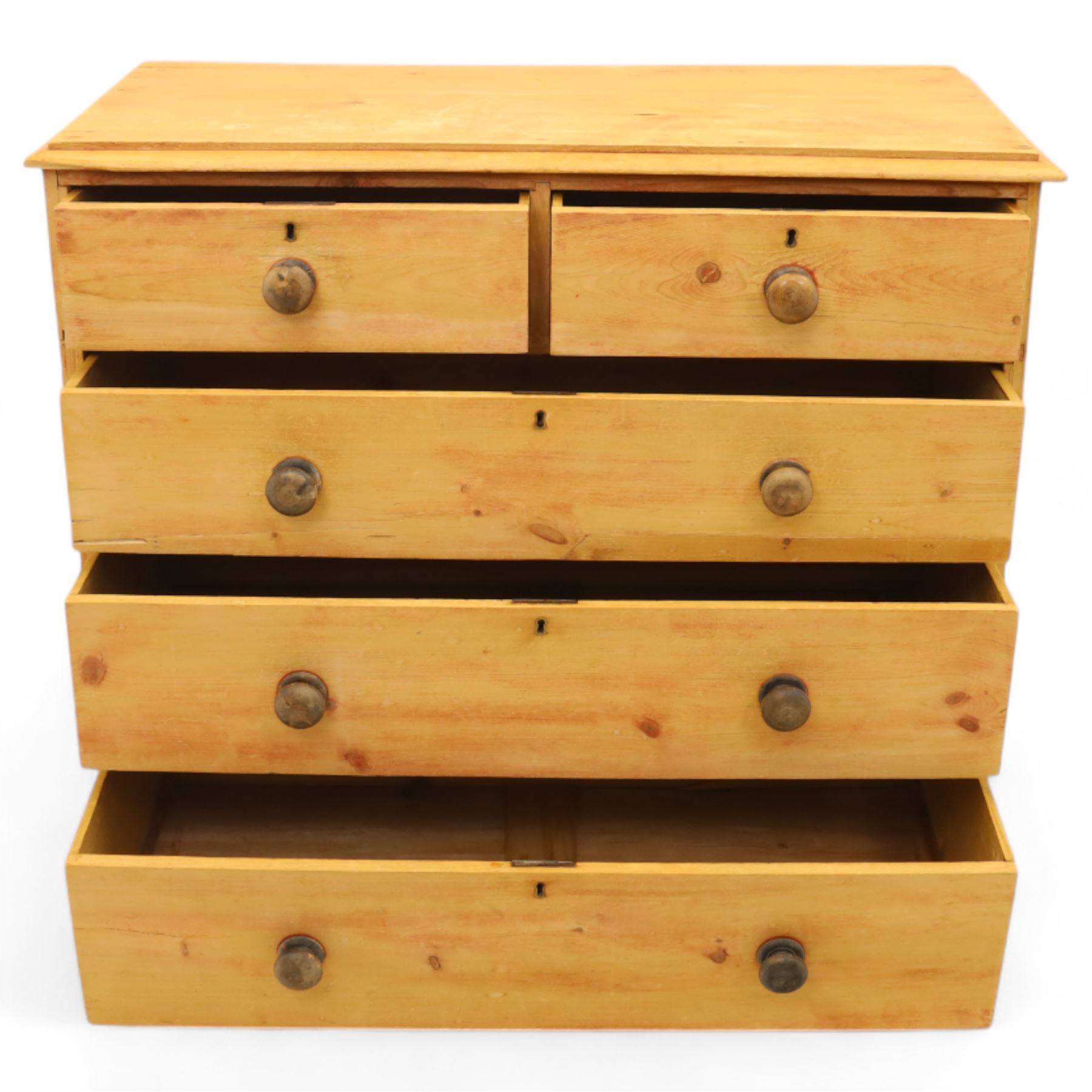 Victorian stripped pine chest, fitted with two short and three long drawers, turned wooden handles, shaped lower apron on bracket feet