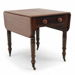 Mahogany drop-leaf Pembroke table circa 1900, with rounded rectangular top and single frieze drawer, raised on turned and tapered supports with brass castors (Extended 128cm)