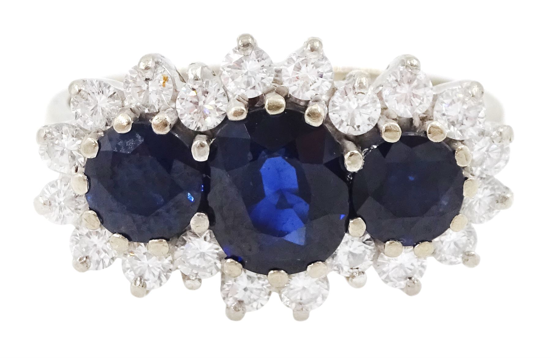 18ct white gold three stone oval and round cut sapphire and round brilliant cut diamond cluster ring, London 1986, total sapphire weight approx 1.80 carat, total diamond weight approx 0.60 carat
