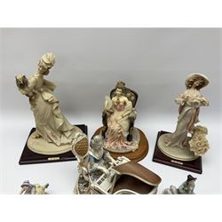 A small pair of Sitzendorf figures modelled as shepherd and shepherdess, H10.5cm together with a Dresden porcelain figure modelled as a female figure playing the piano, H17cm, a Naples figure with floral bouquet, H27.5cm,  a Naples figure holding a dog, H33cm, and a Leonardo Collection figure, Interlude, H24cm. 