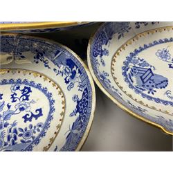 Early 19th century Spode dessert set, circa 1805-1830, blue and white transfer printed in the Grasshopper pattern, comprising comport of oblong form with twin naturalistically modelled branch handles, two oval dishes, and six plates, each with blue or green printed mark beneath, including handles comport H11.5cm W34cm, oval dishes W26.5cm, plates D20.5cm