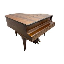  Antonin Petrof - Walnut overstrung baby grand piano, 7 0catve 85 key compass with original strings, tuning pins, damper felts and hammer heads, with roller keyboard action and iron frame, sustaining and una-corda pedals, sliding open lattice music desk, supported on square tapering legs with brass cups and castors, with inner ebonised key fall and ivorine label inscribed 'Supplied by Harrods, London'.