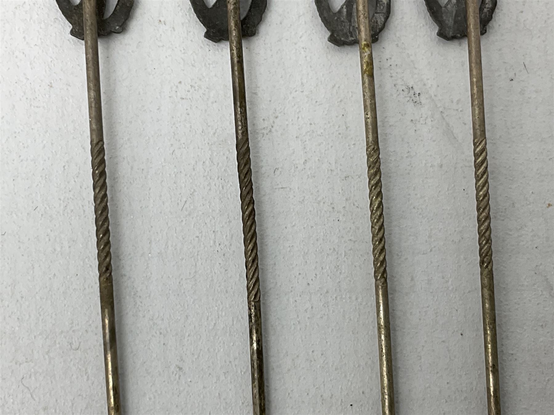 Nine WW2 German lapel pins including five Infantry Assault, Tank Assault etc 