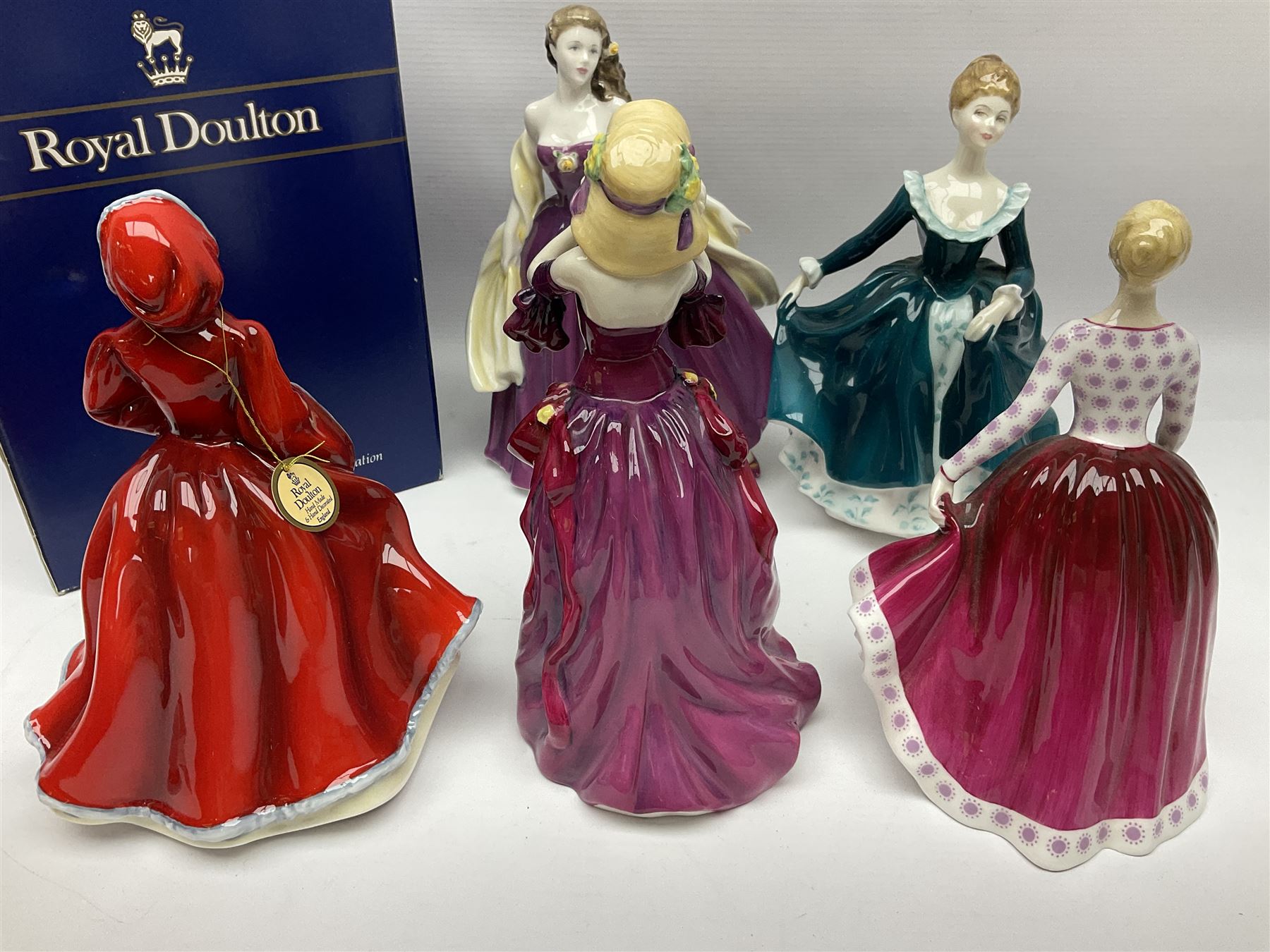 Eight Royal Doulton figures, comprising Rachel HN2936, The Skater HN3439, Janine HN2461, Innocence HN2842, Special Celebration HN4234, Autumn HN4272, Fiona HN2694 and Winsome HN2220, together with three smaller Royal Doulton figures My First Figurine HN3424, Buttercup HN3268 and Autumn Breezes HN2176