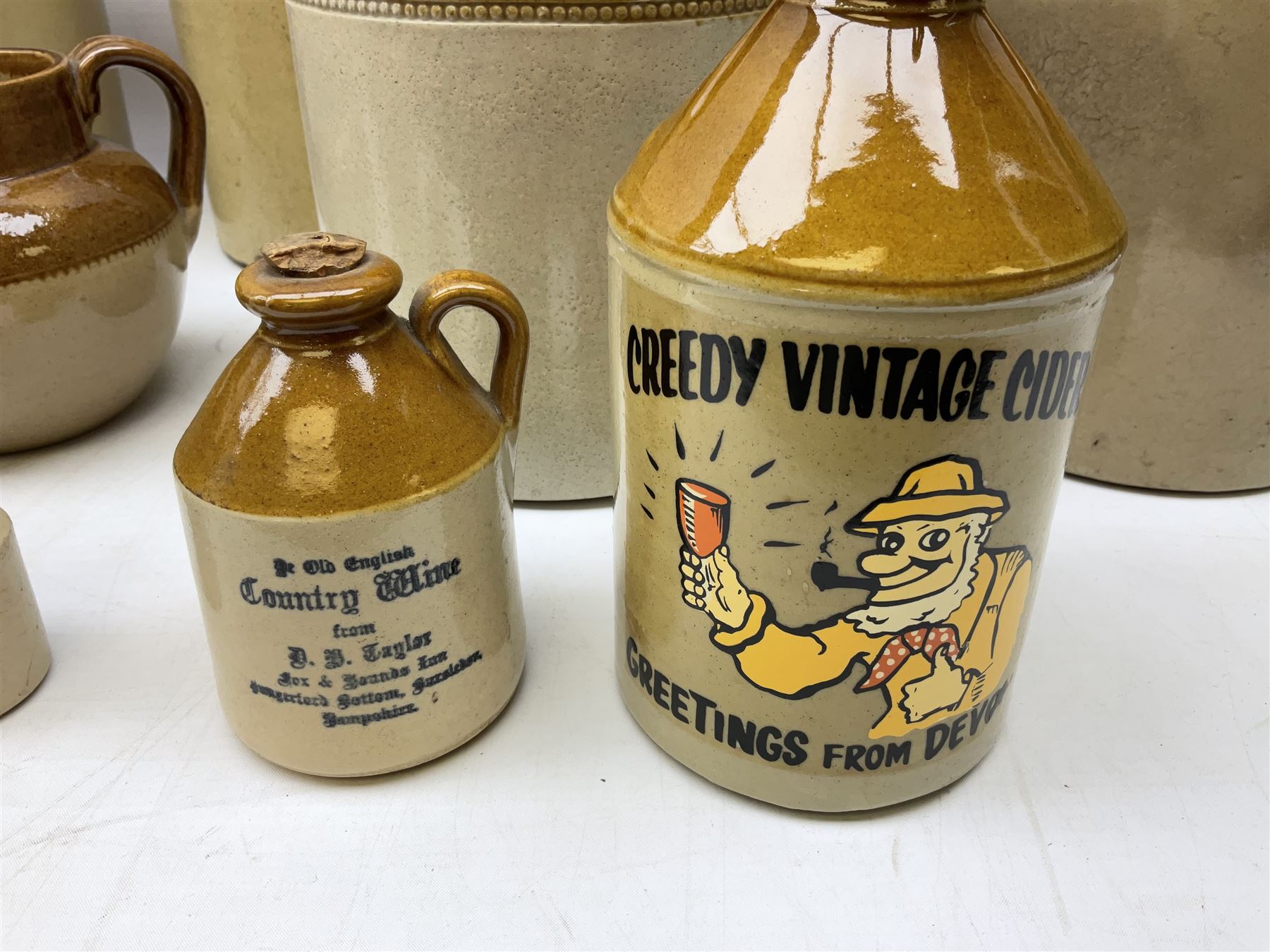 Quantity of salt glazed stoneware flagons, two tone jars and jug etc, to include some with impressed marks and labels, largest H26cm