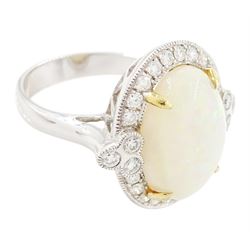 18ct white gold opal and diamond cluster ring, single cabochon cut opal of approx 5.20 carat, surrounded by round brilliant cut diamonds, in a milgrain setting, stamped 750, total diamond weight approx 0.55 carat