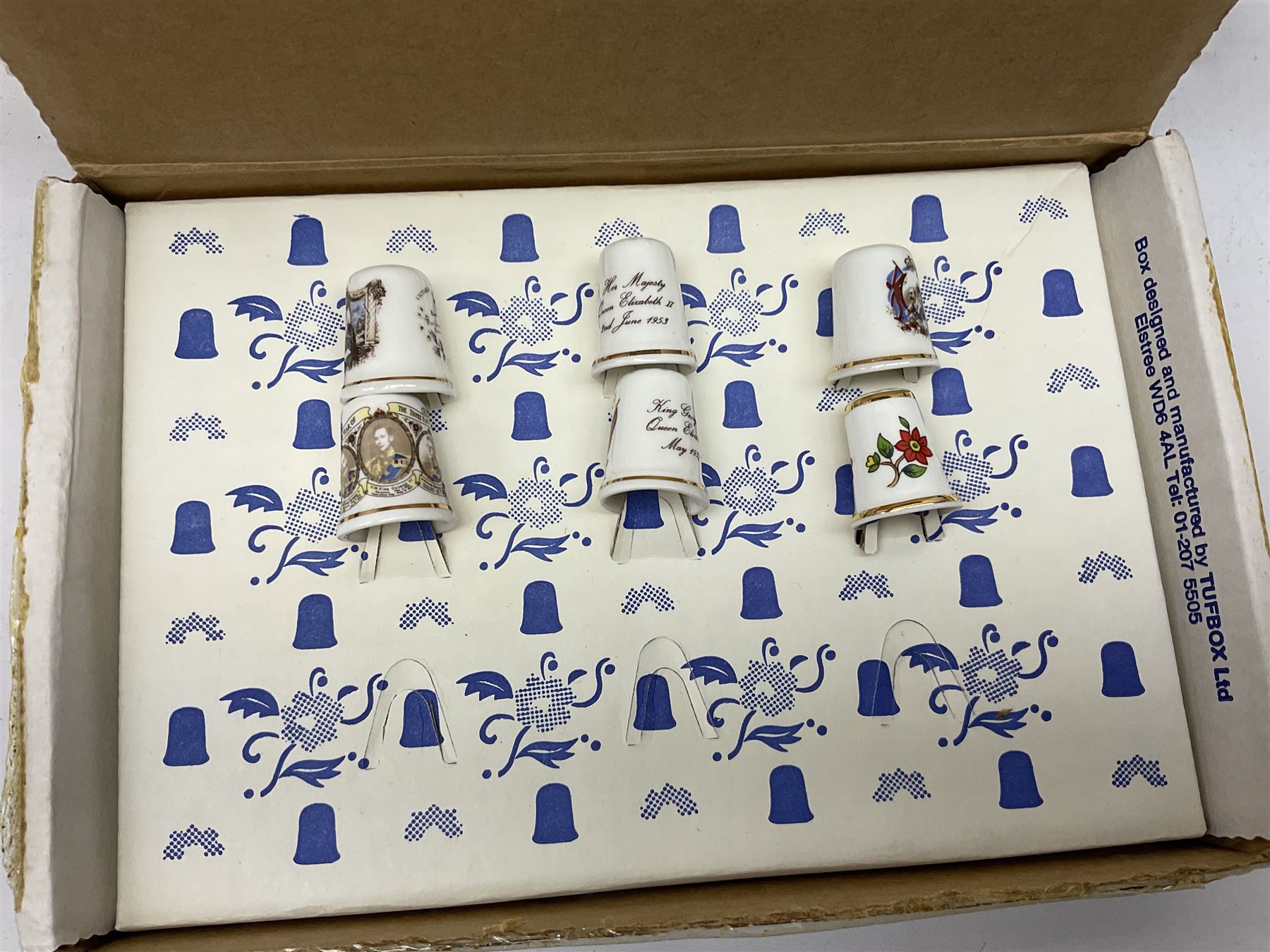 Quantity of thimbles to include twelve Irish Dresden lace examples, Royal Crown Derby, Spode, Portmeirion, Wedgwood, Royal Grafton etc, together with three display cases, many with certificates