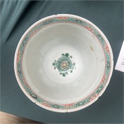 Three Chinese famille verte examples, approximately Yongzheng period, to include two teabowls and two saucers, each decorated with flowers and butterflies, two with sacred fungus mark within double rings, the teabowl with lotus mark, the other indistinct - possibly a Wan mark within lozenge (4)