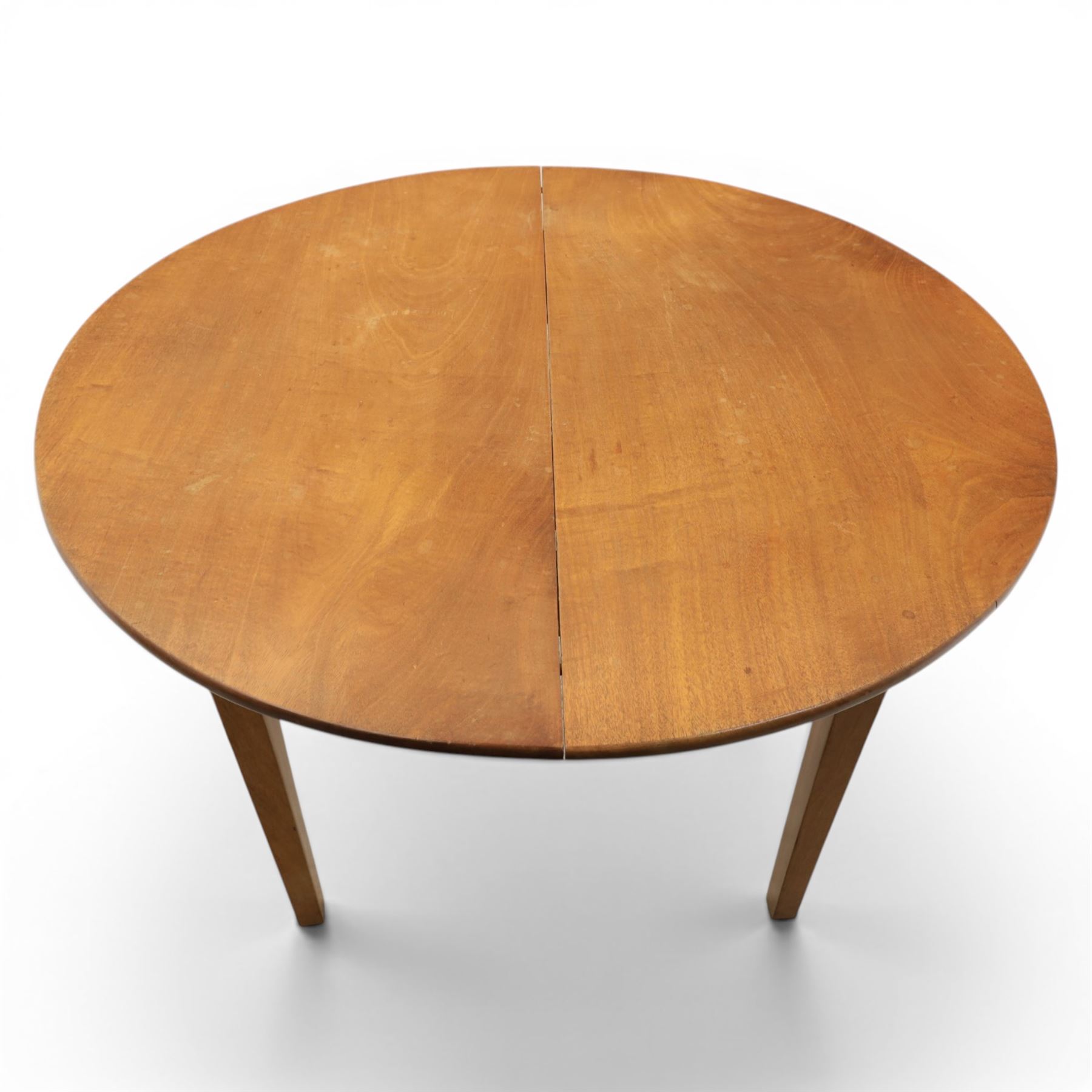 Mid 20th century teak extending dining table, together with eight teak chairs with green leather seats, extends to 154cm