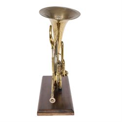 Boosey & Co Ltd French horn, converted into a table lamp, upon a wooden plinth, H45cm