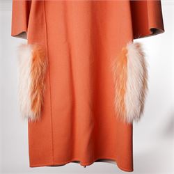 Fendi Roma - wool cape coat in 'Cayenne' orange peach, with concealed front fastening and short flared cape sleeves, applied with dyed arctic fox fur patch pockets, size 40, unused with original tags