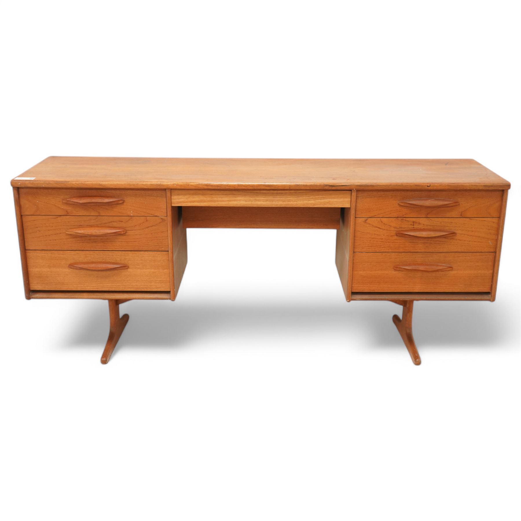 Austinsuite - mid-20th century teak dressing table or desk, fitted with seven drawers