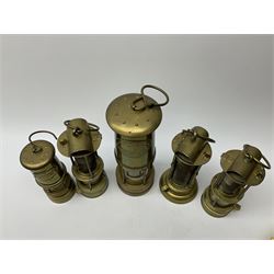 A collection of five mining lamps, to include examples by F Thomas & William Ltd, H25.5cm, Ferndale Coal, 18cm, and Daidler Durham, H21cm, plus two unmarked examples.