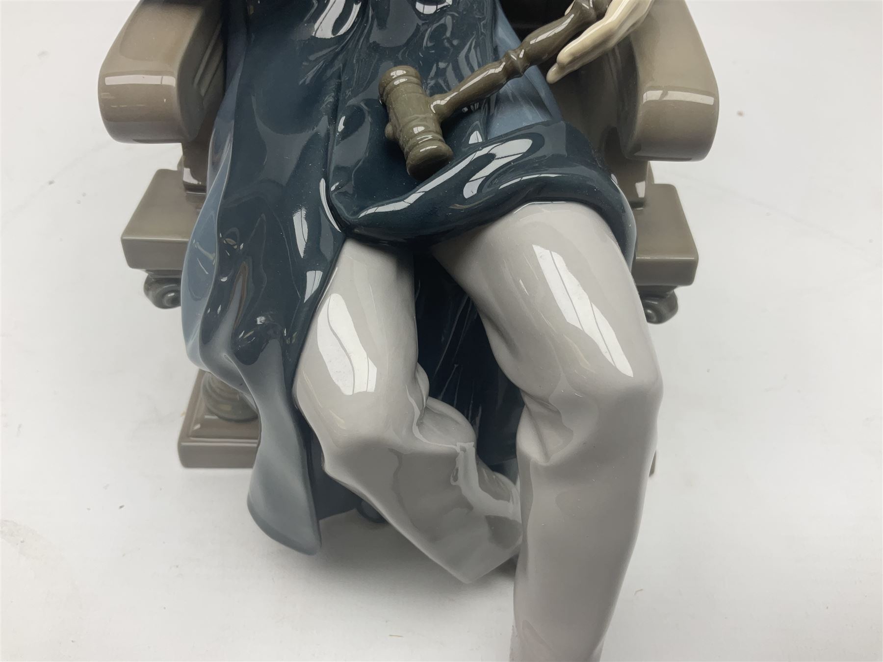 Lladro figure, Justice, modelled as a judge sat in a char, sculpted by Salvador Furió, with original box, no 5489, year issued 1988, year retired 1993, H34cm 