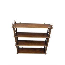 Early 20th century rosewood finish four tier wall rack, spiral turned end supports with X uprights
