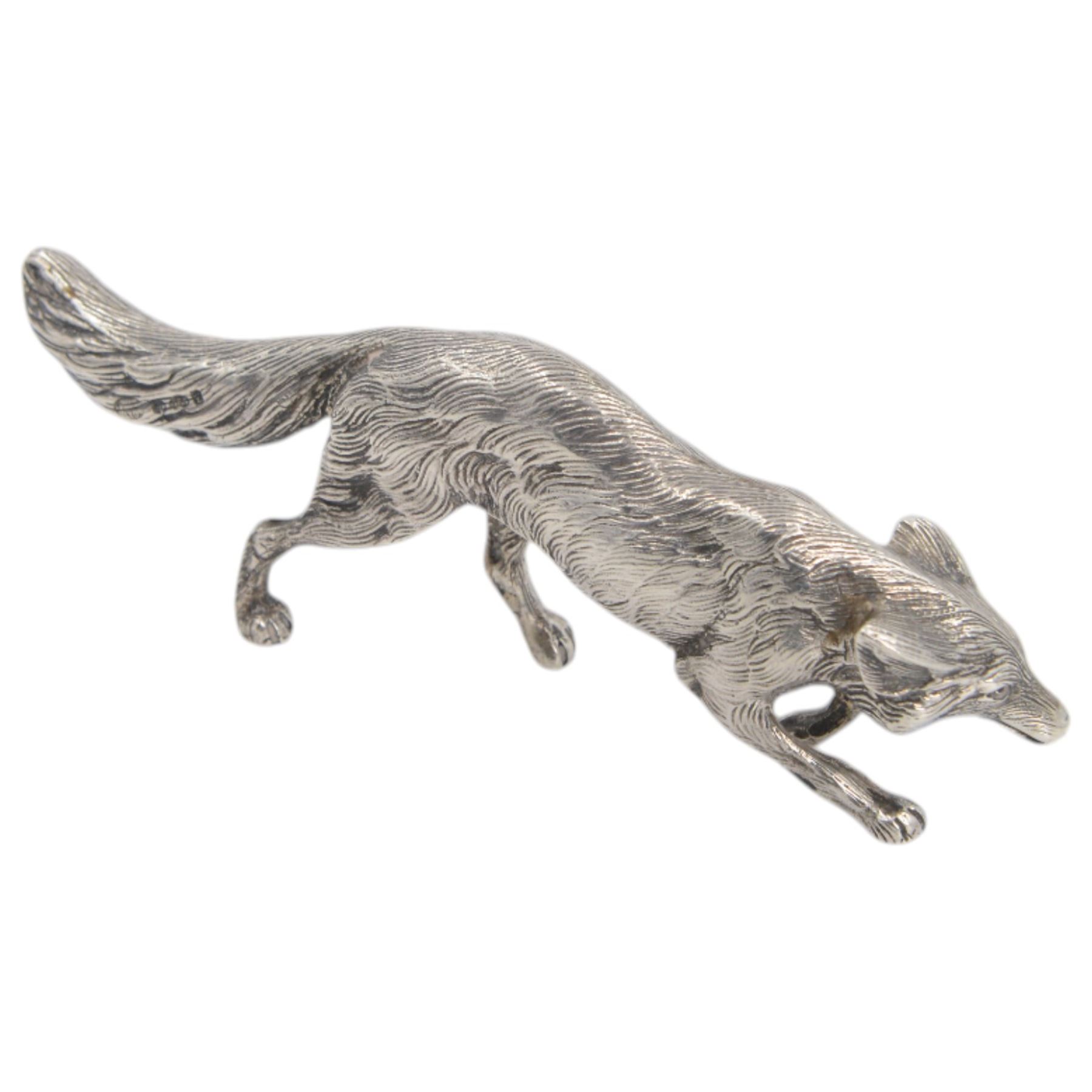 German silver model of a prowling fox, stamped Germany Sterling to underside of tail, together with a Continental silver model of a hair, with London import mark for 1971, tallest H6cm 