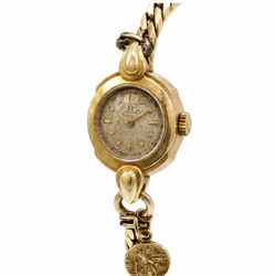 Omega ladies 18ct gold manual wind wristwatch, Cal. 212, silvered dial with dagger and dot hour markers, Birmingham 1953, on 9ct gold bracelet, with fold-over clasp, hallmarked