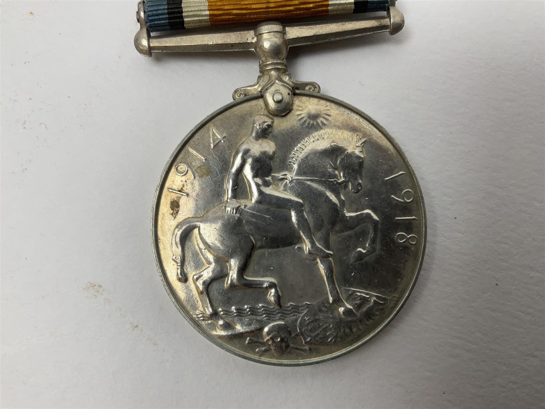 WW2 German Luftwaffe Mess cutlery comprising table spoon and fork, each with H.M.Z.38 mark; WW1 British War Medal awarded to L-13858 Gnr. J. McCabe R.A.; and small quantity of military badges, rank pips etc