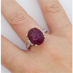 18ct white gold carved ruby ring, set with two baguette cut diamonds either side and diamond set shoulders, ruby approx 6.00 carat