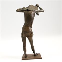 Hylton Stockwell (British): Limited edition bronze sculpture of a woman pulling a shirt over her head, signed and dated 2002, 2/4, H22cm