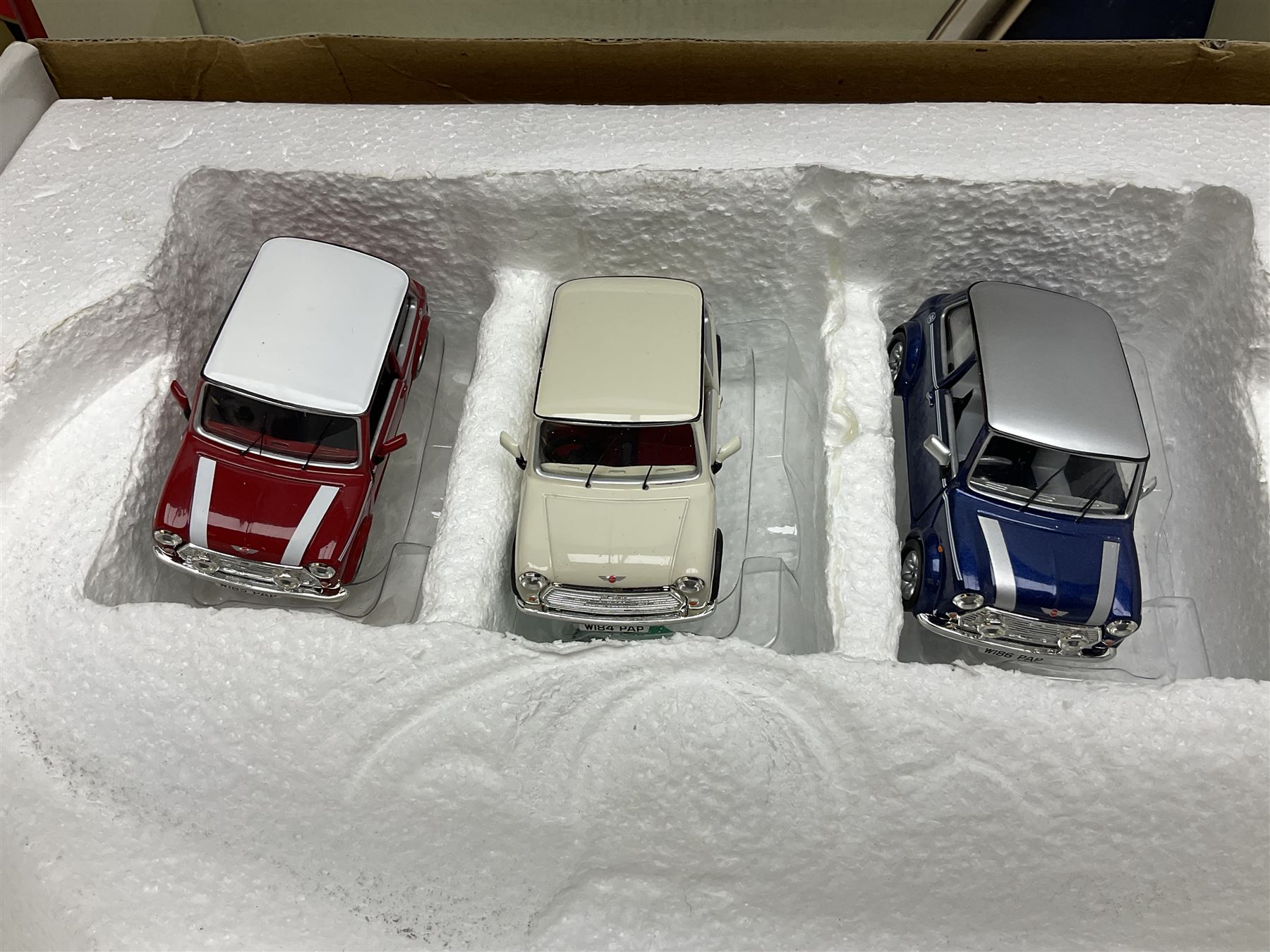Two Bburago 1:18 scale die-cast models - Volkswagen New Beetle 1998 and Volkswagen Kafer-Beetle 1955; Corgi CC99109 Cooper 'S' three-piece set on dashboard stand; Saico 1956 Morris Minor 1000 limited edition twin-pack; and Corgi limited edition 59564 Guinness Scania Tanker and Drop-side lorry set; all boxed (5)
