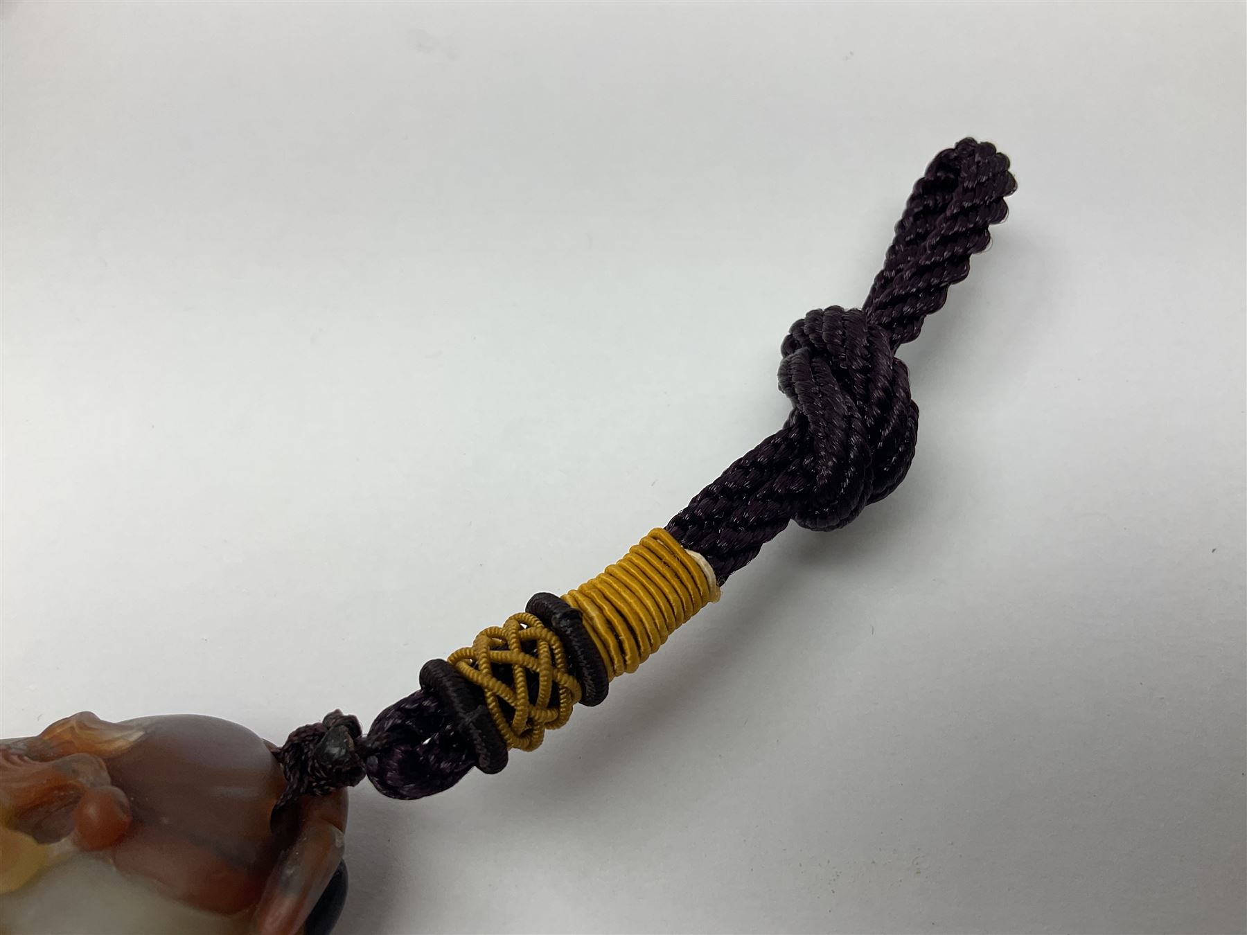 Chinese hardstone carving of a fish amongst coral, with platted rope handle, together with other hardstone and soft stone carvings  